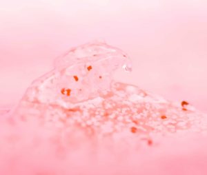 Exfoliator on a pink background
